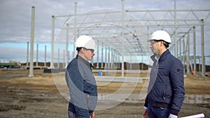 Businessman engineer architect contractor customer manager builder in hard hats having agreement handshake on