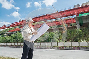 Businessman or Engineer or Architect wearing Hardhat and safety