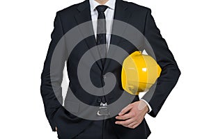 Businessman engineer holding helmet