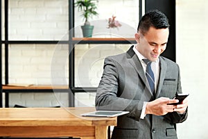 Businessman enjoy texting on mobilephone