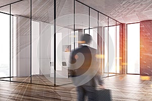 Businessman entering white conference room