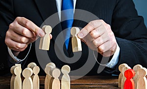 A businessman evaluates candidates for employment. Staff and Human Resource Management. Team building. Personnel selection.