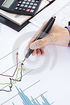 Businessman examining financial charts