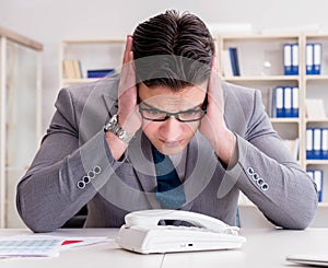 Businessman expecting important call on phone