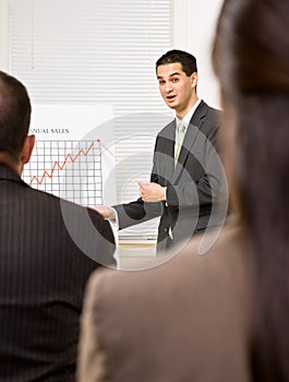 Businessman explaining chart