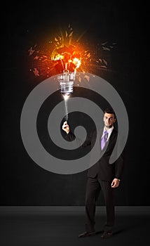 Businessman with an explosion bulb