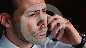 Businessman face talking on smartphone. Entrepreneur having phone conversation