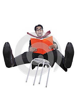 Businessman falling from a chair