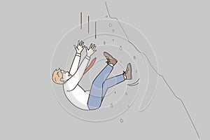Businessman falling from cliff