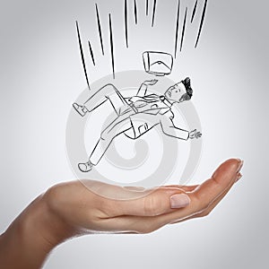 Businessman falling down on hand