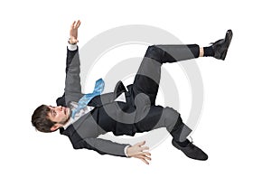 Businessman is falling down. Isolated on white background