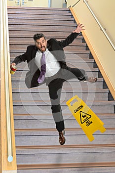 Businessman Falling on Stais