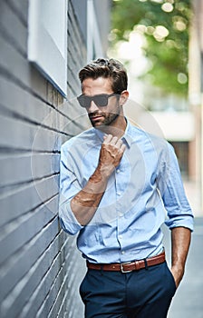 Businessman, fashion and sunglasses in urban area for professional career, job or salesman with pride. Employee, male