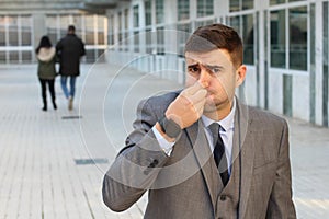 Businessman feeling grossed out at work photo