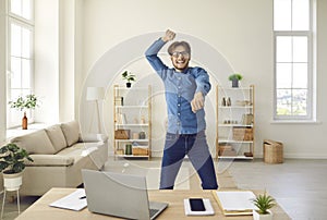 Businessman feeling happy and excited and dancing gangnam style after finishing work