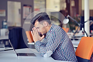 Businessman feeling headache while doing distance work in coffee shop tired with failure of plans