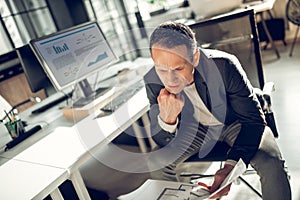 Businessman feeling overloaded having too much work