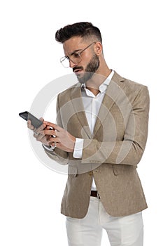Businessman feeling perplex over some text he received
