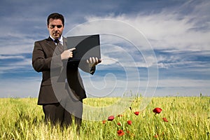 Businessman in a field