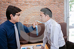 businessman fighting and disagree about business marketing in room background