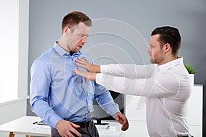 Businessman Fighting With His Colleague In Office