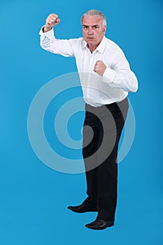 Businessman in a fighting stance.