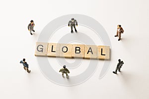 Businessman figures at global words
