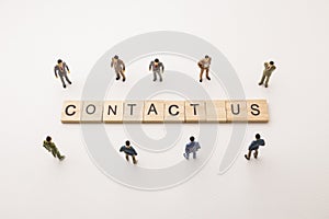Businessman figures meeting on contact us conceptual