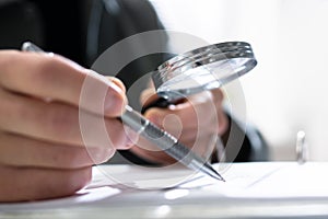 Businessman Finance Investigation Using Magnifying Glass