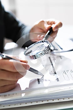 Businessman Finance Investigation Using Magnifying Glass