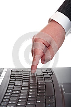 Businessman finger on the laptop's keyboard