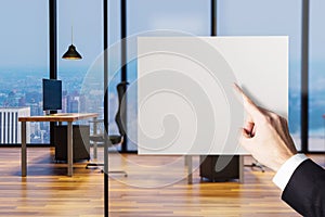 Businessman finger pointing at blank billboard in clean office 3D illustration