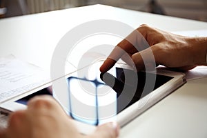 Businessman finger pointing to the screen of a tablet