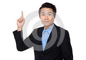 Businessman with finger pointing upwards
