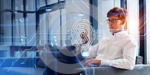 Businessman finger touch fingerprint hologram with laptop on sofa