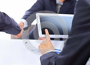 Businessman with finger touching screen