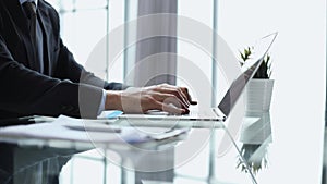 businessman finger typing on computer keyboard in office