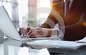 businessman finger typing on computer keyboard in office