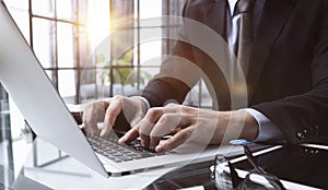 businessman finger typing on computer keyboard in office