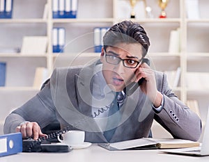 Businessman during fire alarm in office