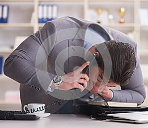 Businessman during fire alarm in office