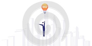 Businessman Flying Above a City with a Lightbulb Ballon - Design Concept Symbolises Creativity, Innovation, Creative Ideas photo