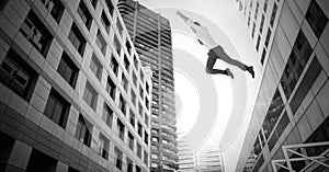 Businessman flying over surreal city buildings perspective