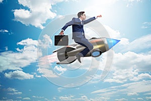 The businessman flying on rocket in business concept
