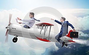 Businessman flying on vintage old airplane