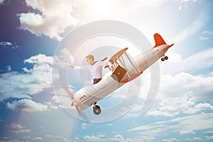 The businessman flying on vintage old airplane