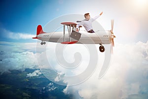 The businessman flying on vintage old airplane