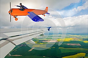 The businessman flying on vintage old airplane