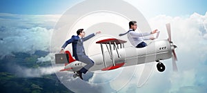 The businessman flying on vintage old airplane