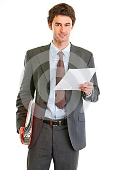 Businessman with folder and document in hand